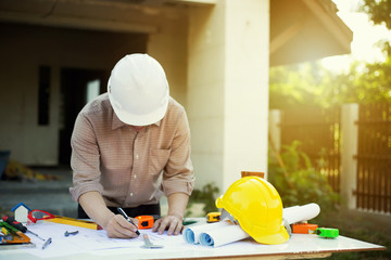 Engineer working with engineering tool on workplace