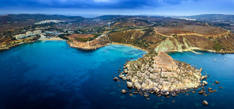 Ghajn Tuffieha, Malta - Aerial panoramic skyline view of the coast of Ghajn Tuffieha with Golden Bay, Riviera Bay, Ghajn Tuffieha Watch Tower and other sandy beaches