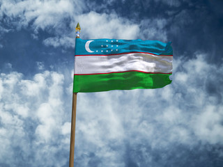 Uzbekistan flag Silk waving flag of Uzbekistan made transparent fabric with wooden flagpole gold spear on background sunny blue sky white smoke clouds real retro photo Countries world 3d illustration