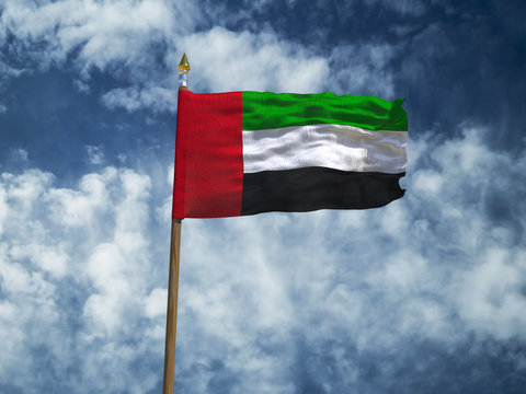 United Arab Emirates flag Silk waving flag of United Arab Emirates UAE made transparent fabric with wooden flagpole gold spear on background blue sky white clouds real retro photo 3d illustration