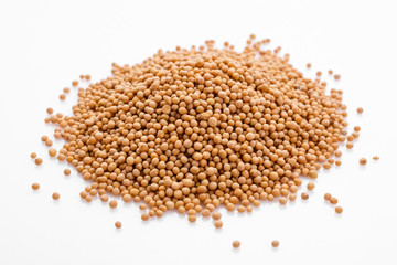 fragrant grains of mustard on a white background