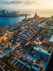Valletta, Malta - Sunrise above Valletta with Our Lady of Mount Carmel church and St.Paul's Cathedral with Sliema at background - obrazy, fototapety, plakaty