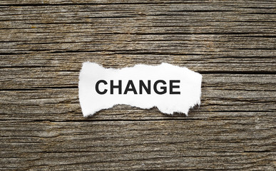 Word CHANGE on the piece of paper