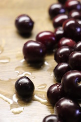 Photo of cherry on wooden table