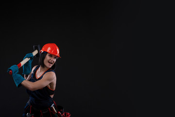 Sex equality and feminism. Sexy girl in safety helmet holding hammer tool. Attractive woman working as construction worker.