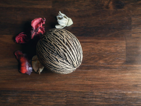 Cerbera oddloam's seed, Pong pong seed or Othalanga on wooden background