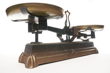 Old Roberval balance scale. Scales weight isolated on white background. With copy space text....