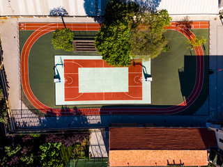 Aerial Drone View of Basketball Court in Garden with Trees
