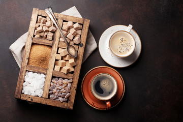 Coffee cups and various brown sugar