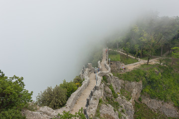 Fototapeta na wymiar Castle on Monte Titano in San Marino in the fog 