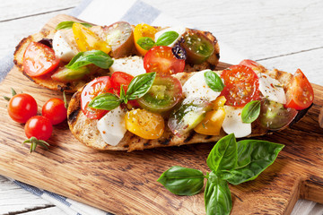 Bruschetta with tomatoes, mozzarella and basil