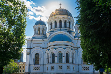 Lithuania, View between green trees on ancient Sankt Michael the Archangel Church in Kaunas