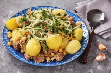 Stewed lamb with potatoes and chikpeas.