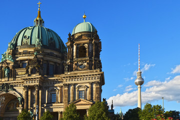 Facade of the Berlin Dome at the Lustgarten and the Berlin TV Tower in the downtown of Berlin in the evening sun.