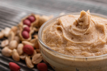 peanut paste on a wooden rustic background
