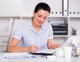 cheerful woman working in the office