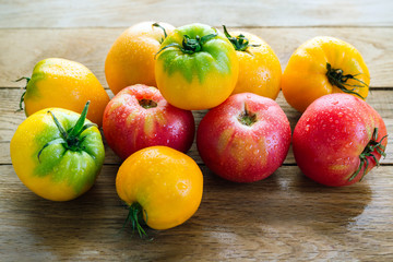 Yellow And Red Tomatoes On A Wooden Table