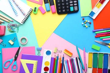 School supplies on colorful background