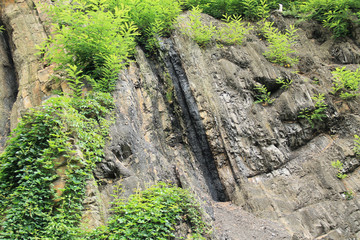 visible layer of coal in the rock on Landek hill near Ostrava, Czech Republic