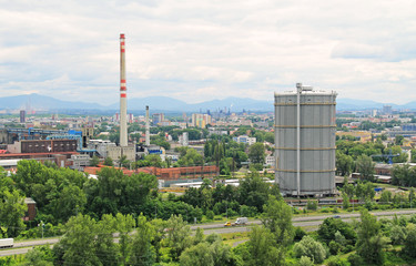 Fototapeta na wymiar view on the industrial city with factory, smokestack and estate housing in Ostrava, Czech Republic