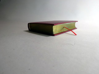Red book on white background