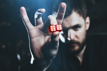 successful man shows dice
