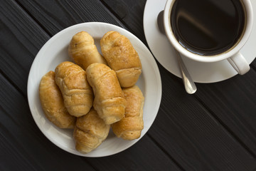 croissants and coffee in a white cup