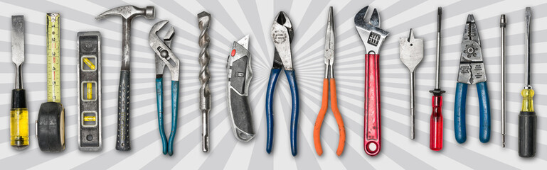 Various used tools on star burst background