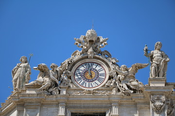 Fototapeta na wymiar Clock at St. Peter's Basilica in the Vatican in Rome, Italy