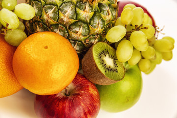 Naklejka na ściany i meble Fruit plate with fresh whole fruits, isolated on white background