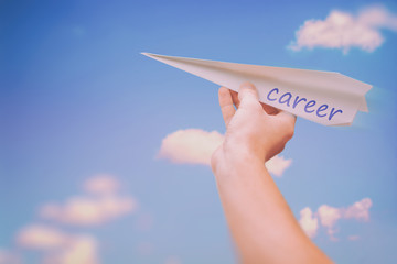 Ascending paper airplane as a metaphor for career advancement and successful career