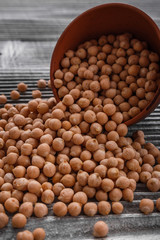 uncooked chickpeas on a wooden rustic background