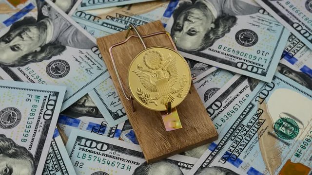 Gold Bitcoin with eagle in the mous trap on the USD dollars background