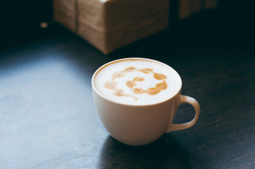 Cup of coffee cappuccino latte art in vintage color tone style