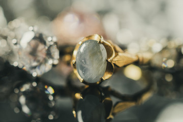 Vintage gold Jewelry blue sapphire rings with reflection on black background