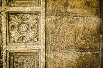 Lviv, Ukraine. Texture. The background. An old stone wall with a pattern. The Golden Wall. Old and weathered large stone blocks wall texture. Grunge.
