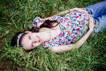 Pregnant tummy in the hands.