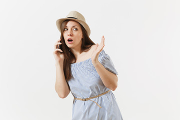 Obraz na płótnie Canvas Surrprised upset young woman dressed blue dress, hat has some problems, hears fake news or unexpected rumor in mobile phone isolated on white background. People, sincere emotions, lifestyle concept.