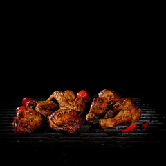 Papier Peint photo Grill / Barbecue Chicken legs and wings on the grill with flames