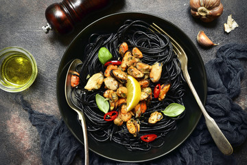 Black spaghetti pasta with mussels.Top view.