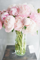 Floristry concept. Bouquet of beautiful flowers on gray table. Spring colors. the work of the florist at a flower shop.