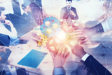 Business team connect pieces of gears. Teamwork, partnership and integration concept with network effect. double exposure