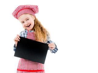 Little girl in chef uniform with blank paper