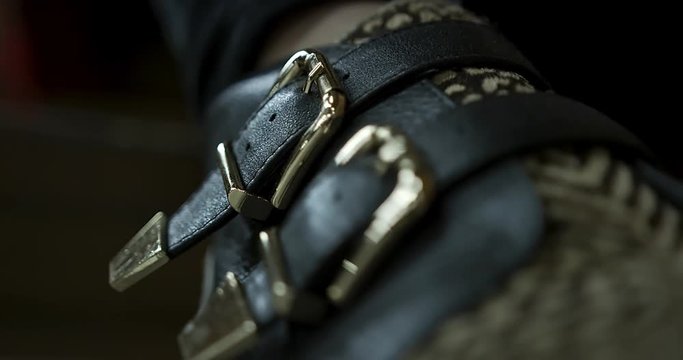 Handheld floaty loseup shot of stylish shoe that goes in and out of focus 