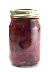 Pickled Beets on a White Background in a Home Canning Jar
