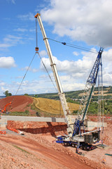 Crane lifting a bridge beam