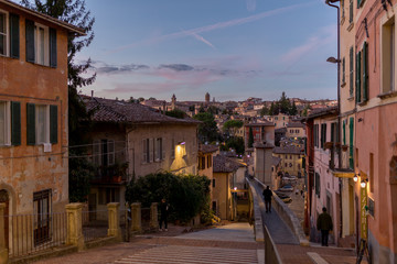 View of old architecture with viaduct in a village in Italy at nightfall