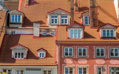 View of old houses walls with windows and roofs in historic center of Riga, Latvia.