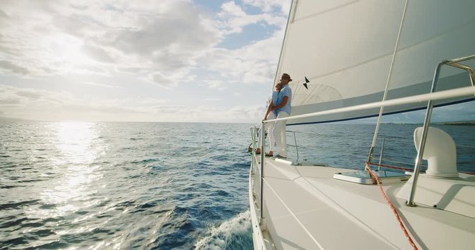 Romantic couple sailing into the sunset