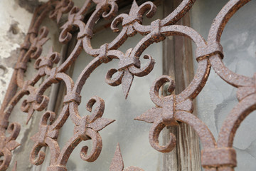 Old rustic rusty window bars.